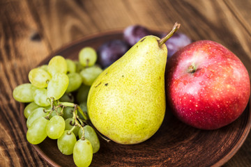 fruit plate grapes apple plum pear
