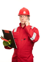Construction foreman with clipboard using smartphone