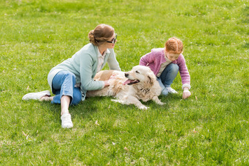 mother and daughter with dog