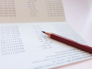 Obraz premium Business, finance, investment or accounting concept : Saving account book or financial statement on office table