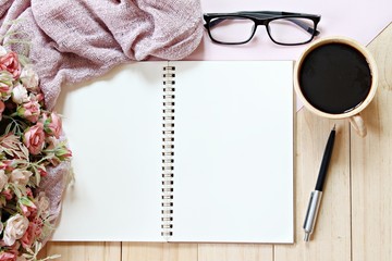 Business, holiday or planning concept : Desk table with scarf, notebook paper and coffee cup, Top view or flat lay with copy space ready for adding or mock up