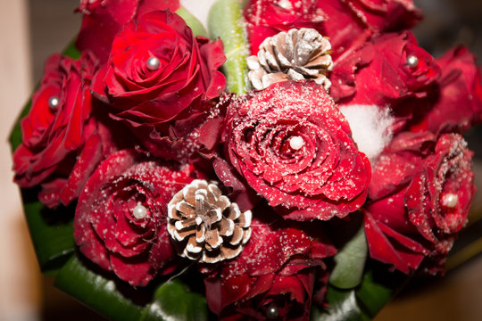bouquet of red rose for a wedding with snowflakes on it