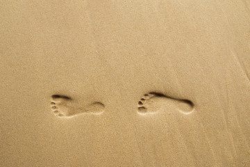 Fototapeta na wymiar Footprints on beach.