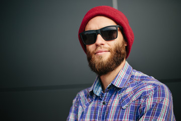 Obraz premium Sexy hipster man with beard posing wearing trendy clothes