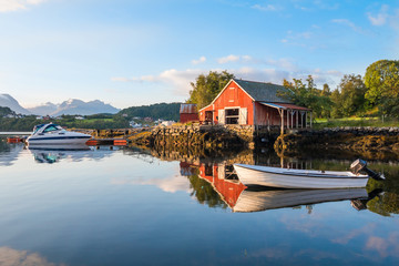 Traditional red fishing rorbu hut near Alesund in Norway