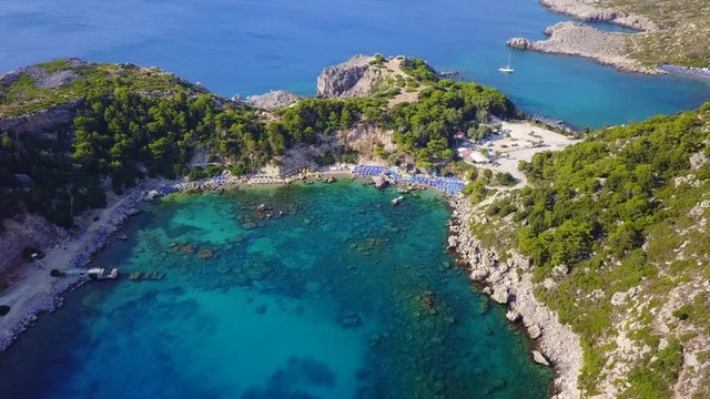 August 2017: Aerial drone video of iconic beach at Anthony Quinn Bay, Rodos island, Aegean, Dodecanese, Greece