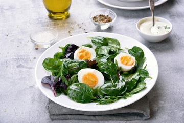 Healthy salad with greens and eggs