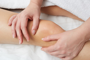 Obraz na płótnie Canvas Female Enjoying Relaxing Back Massage In Cosmetology Spa Centre