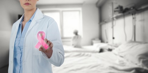 Composite image of female doctor using digital screen