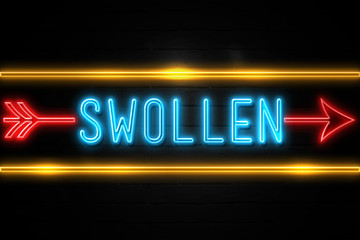 Swollen  - fluorescent Neon Sign on brickwall Front view