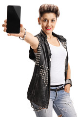 Punk girl showing a phone to the camera