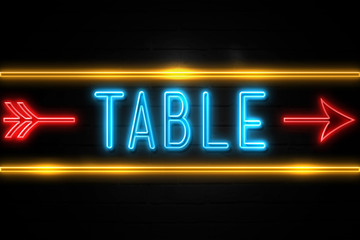 Table  - fluorescent Neon Sign on brickwall Front view