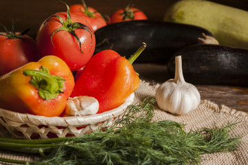 tomatoes, pepper, garlic and dill on a linen centerpiece