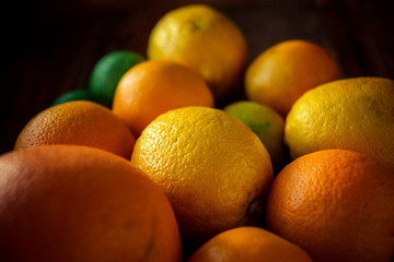 Sliced citrus fruits, vitamins, oranges, grapefruits, limes, juicy fruits background