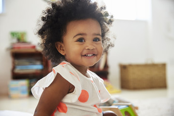 Happy Baby Girl Playing With Toys In Playroom - obrazy, fototapety, plakaty