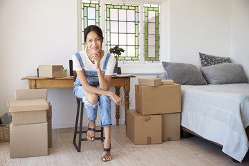 Portrait Of Woman In Bedroom Running Business From Home