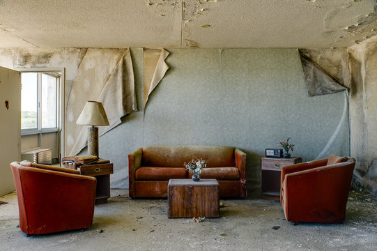 Intact Lodging Room with Burnt Orange Chairs & Couch - Abandoned Hotel