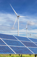 solar panels and wind turbines generating electricity in power station green energy renewable with blue sky background 