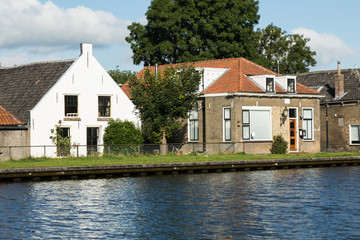 Dutch typical houses by the river bank