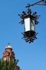 Fototapeta na wymiar Beautiful iron lantern on the background of the blue sky
