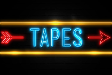 Tapes  - fluorescent Neon Sign on brickwall Front view
