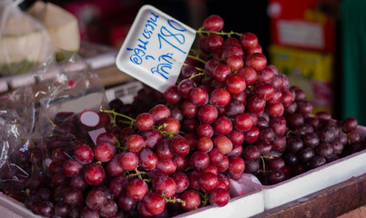 Organic red grapes sell at fruit store in Chiang Mai Thailand