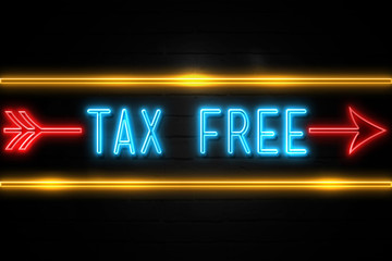 Tax Free  - fluorescent Neon Sign on brickwall Front view