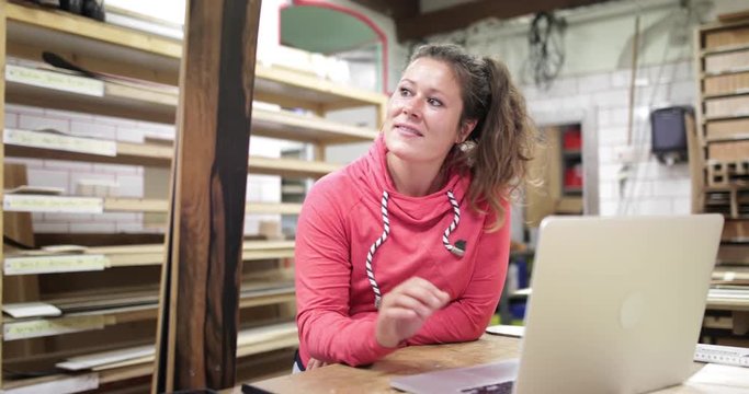 Craftsperson working in snowboard workshop