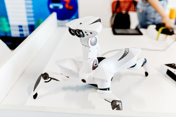 A small white spider robot - arachnoid. Artificial Intelligence and spy military electronic devices...