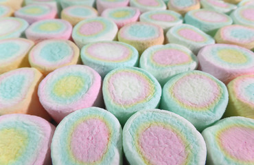 Closed Up Texture of Lined up Pastel Pink, Yellow, Blue Colored Marshmallow Candies for Background, Banner, Pattern 