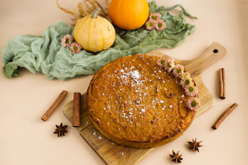 Fototapeta na wymiar Vegetable pumpkin cake on brown background