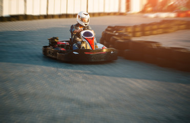Karting competition or racing cars riding for victory on a racetrack - obrazy, fototapety, plakaty