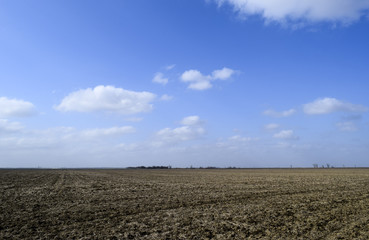 The plowed field. Spring processing of farmlands.