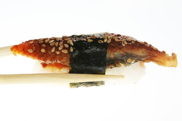 Sushi with chopsticks shot on white