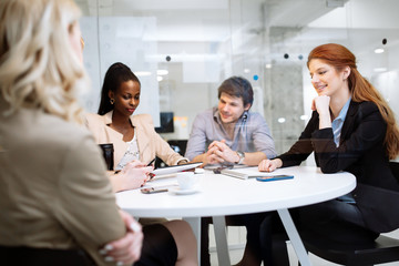 Group of business people sitting at desk