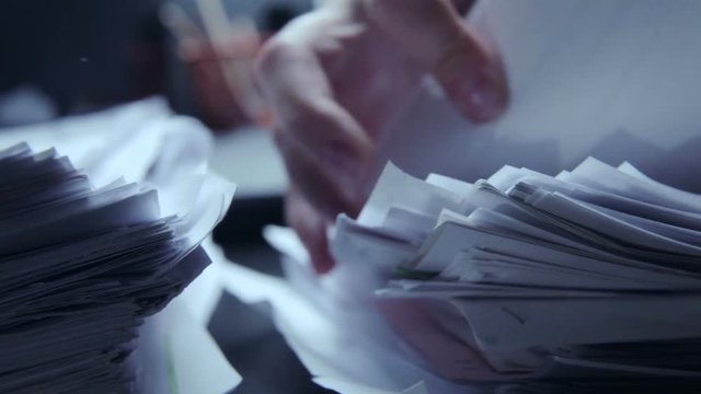 Working in office with documents and computer