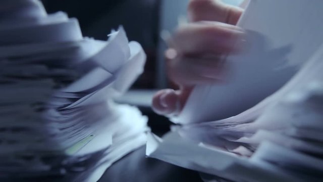 Working in office with documents and computer