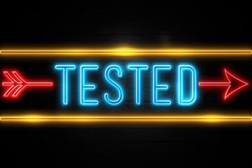 Tested  - fluorescent Neon Sign on brickwall Front view