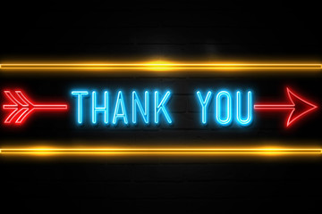Obraz premium Thank You - fluorescent Neon Sign on brickwall Front view