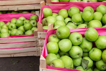 green apples in a wooden box