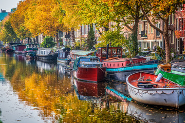 beautiful canals in Amsterdam in autum, Holland - obrazy, fototapety, plakaty