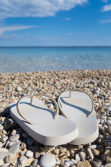 Close Up Of Sandals On Beautiful Greek Beach