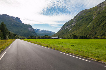 Panorama of summer landscape in Norway - river, stones, mountings