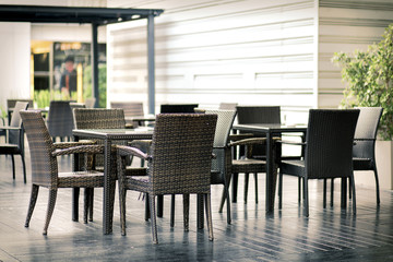 Outdoor furniture rattan armchairs and table on terrace