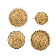 Integral Wholegrain rice into a bowl, basket and cup