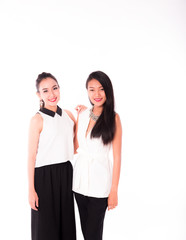 portrait of two attractive caucasian and asian smiling women isolated on white studio