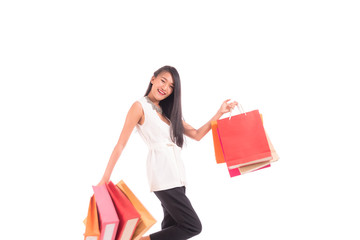 Cheerful shopping woman of Asian holding bags. Shopping smart business woman happy smiling holding colorful shopping bags isolated on white . Fresh young Asian female model