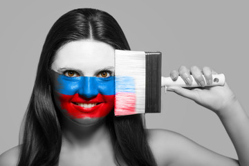 Female supporter in national colors of Russia