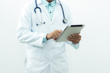 Closed up of Smart  professional man doctor with a stethoscope ,an iPad tablet search something isolated on white background.