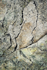 abstract cracks on a granite block of stone